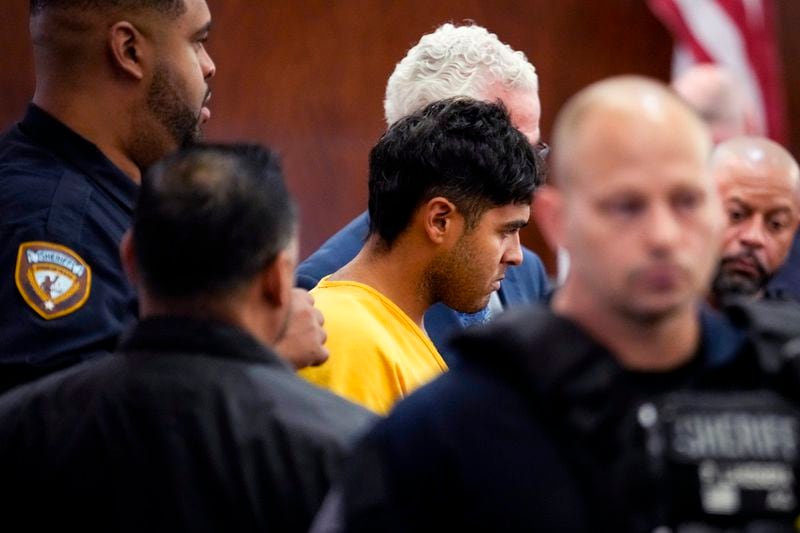 Johan Jose Rangel-Martinez, one of the two men accused of killing 12-year-old Jocelyn Nungaray, is surrounded by deputies as he is led from the courtroom on Tuesday, June 25, 2024 in Houston. Capital murder charges have been filed against Johan Jose Rangel Martinez and Franklin Jose Pena Ramos, in the strangulation death of the 12-year-old. (Brett Coomer/Houston Chronicle via AP)