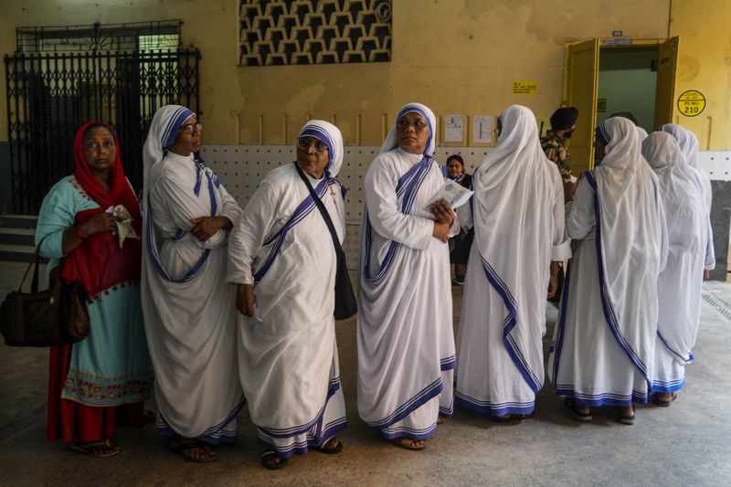 Nuns of the Missionaries of Charity, the order founded by Saint Teresa, stand in queue to cast their votes during the last round of a six-week-long national election, in Kolkata, India, Saturday, June 1, 2024. Indians began voting Saturday in the last round of a six-week-long national election that is a referendum on Hindu nationalist Prime Minister Narendra Modi’s decade in power. (AP Photo/Bikas Das)