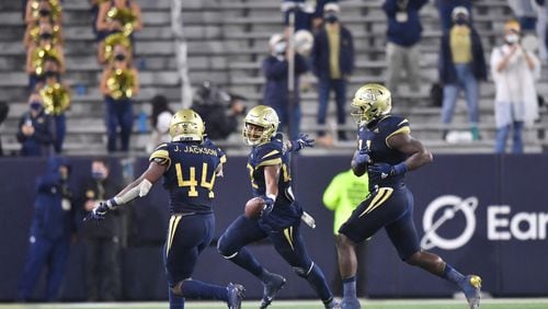 October 9, 2020 Atlanta - Georgia Tech's defensive lineman Jordan Domineck (center) celebrates with teammates after he recovered a fumble during the second half of an NCAA college football game at Georgia Tech's Bobby Dodd Stadium in Atlanta on Friday, October 9, 2020. Georgia Tech's won 46-27 over the Louisville. (Hyosub Shin / Hyosub.Shin@ajc.com)