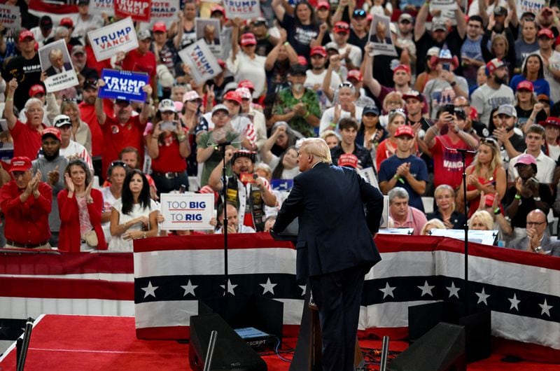 Former President Donald Trump, the Republican nominee for president, speaks during a rally earlier this month at the Georgia State University Convocation Center. Trump and Vice President Kamala Harris, the Democratic nominee, both held rallies within days of each at the center in downtown Atlanta, signaling how important Georgia's role is in this year's election. That will be further evidenced in the coming week during the Democratic National Convention in Chicago, where several Georgians could fall under the spotlight as speakers. (Hyosub Shin / AJC)