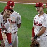 Philadelphia Phillies first baseman Bryce Harper, left, has already been named the starting first baseman for the National League in the All-Star Game. Shortstop Trea Turner, middle, and third baseman Alec Bohm, right, will join him in the lineup at shortstop and third base. (Elizabeth Robertson/The Philadelphia Inquirer/TNS)