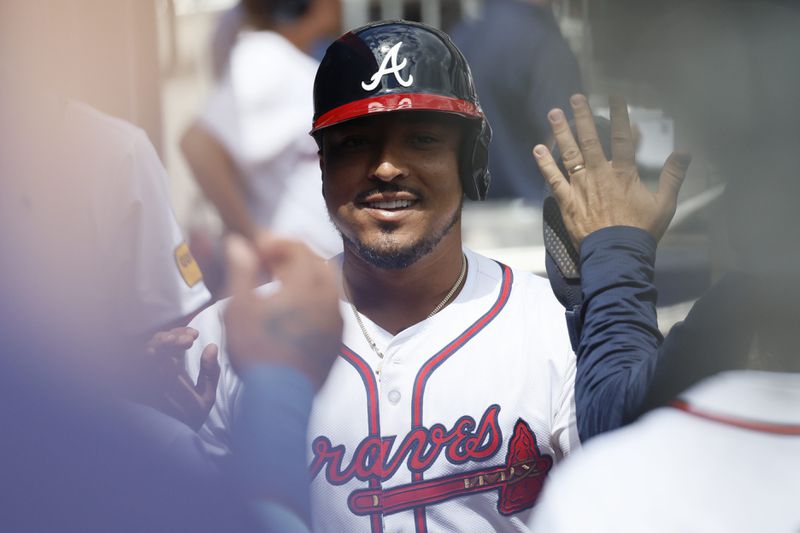 Atlanta Braves catcher Chadwick Tromp (45) high-fives teammates at the dugout after scoring his team’s third run during the fifth inning against the New York Mets at Truist Park on Thursday, April 11, 2024.
Miguel Martinez / miguel.martinezjimenez@ajc.com 