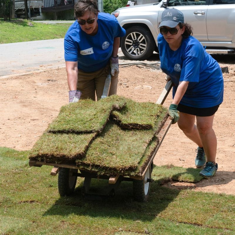 In another project that involved Cobb Community Foundation, volunteers from Genuine Parts Company laid sod during a 2023 NW Metro Atlanta Habitat for Humanity build. Courtesy of NW Metro Atlanta Habitat for Humanity