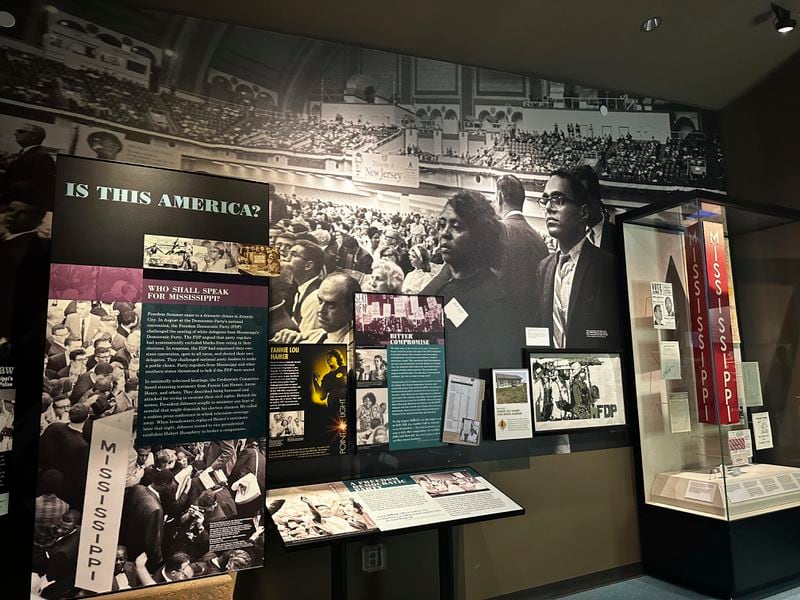 A collection of photographs from the 1964 Democratic National Convention on display inside the "I Question America" exhibit in the Mississippi Civil Rights Museum on Wednesday, Aug. 14, 2024, in Jackson, Miss. (AP Photo/Stephen Smith)