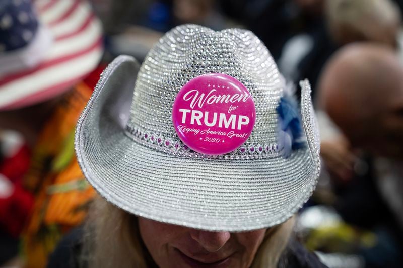  An attendee wearing a “Women for Trump” button on her hat, prior to a scheduled rally for former President Donald Trump in Rome, Ga. on March 9, 2024. (Nicole Craine/The New York Times) 