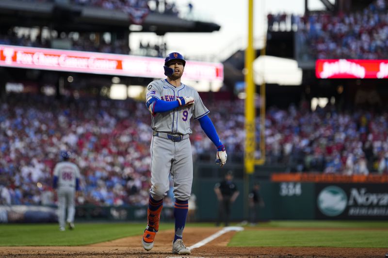 New York Mets' Brandon Nimmo reacts after hitting a home run against Philadelphia Phillies pitcher Orion Kerkering during the seventh inning of Game 2 of a baseball NL Division Series, Sunday, Oct. 6, 2024, in Philadelphia. (AP Photo/Matt Slocum)