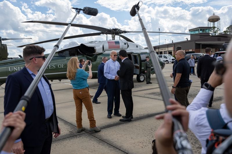 President Joe Biden greets people Thursday after leaving Marine One at Moody Air Force Base in Valdosta. The president was on his way to survey damage from Hurricane Helene. (Arvin Temkar / AJC)
