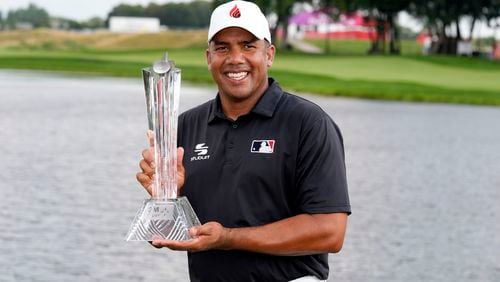 Jhonattan Vegas holds the trophy after winning the 3M Open golf tournament at the Tournament Players Club, Sunday, July 28, 2024, in Blaine, Minn. (AP Photo/Charlie Neibergall)