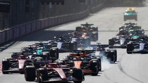 Ferrari driver Charles Leclerc of Monaco leads at the start of the Formula One Grand Prix in Baku, Azerbaijan, on Sunday, Sept. 15, 2024. (AP Photo/Sergei Grits)