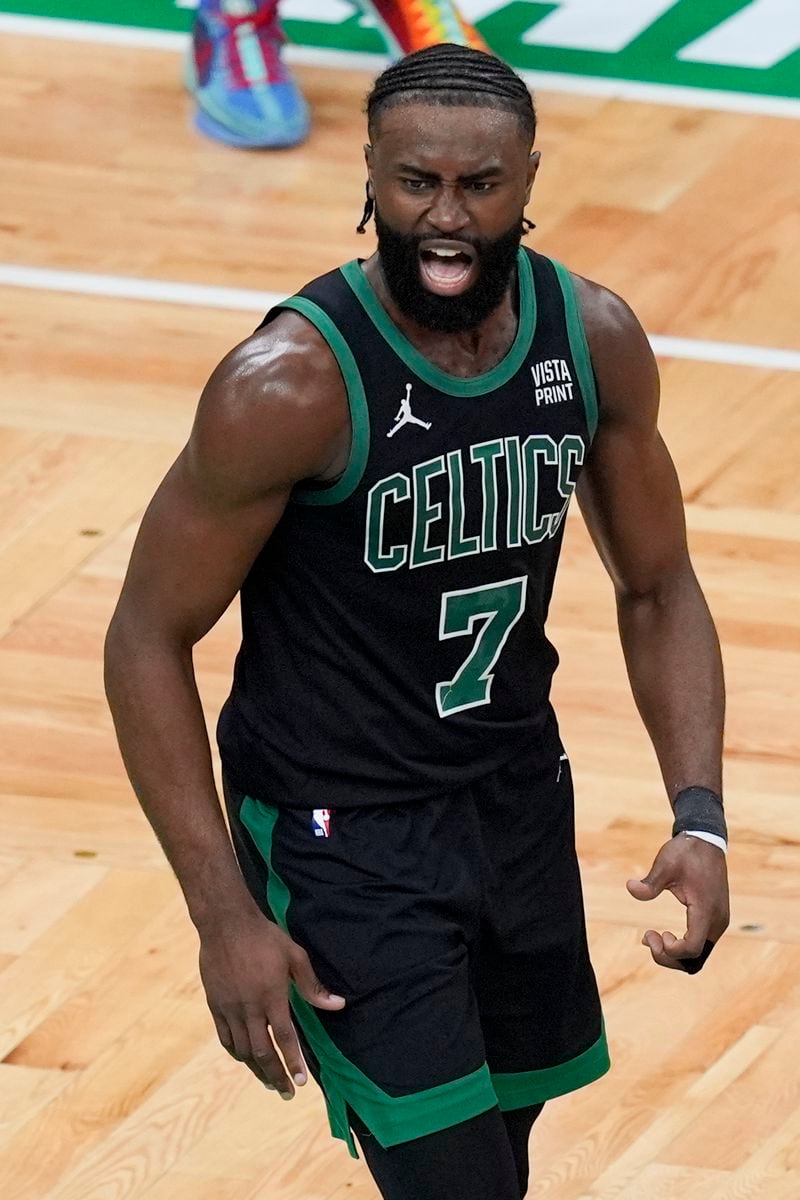 Boston Celtics guard Jaylen Brown (7) reacts after scoring during the first half of Game 2 of the NBA Eastern Conference basketball finals against the Indiana Pacers, Thursday, May 23, 2024, in Boston. (AP Photo/Michael Dwyer)