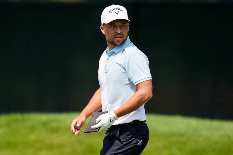 Xander Schauffele walks on the first fairway during the final round of the Tour Championship golf tournament, Sunday, Sept. 1, 2024, in Atlanta. (AP Photo/Mike Stewart)