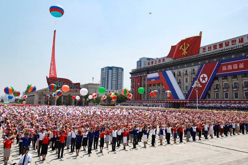 North Korea's people attend the official welcome ceremony with Russian President Vladimir Putin and North Korea's leader Kim Jong Un in the Kim Il Sung Square in Pyongyang, North Korea, on Wednesday, June 19, 2024. (Vladimir Smirnov, Sputnik, Kremlin Pool Photo via AP)