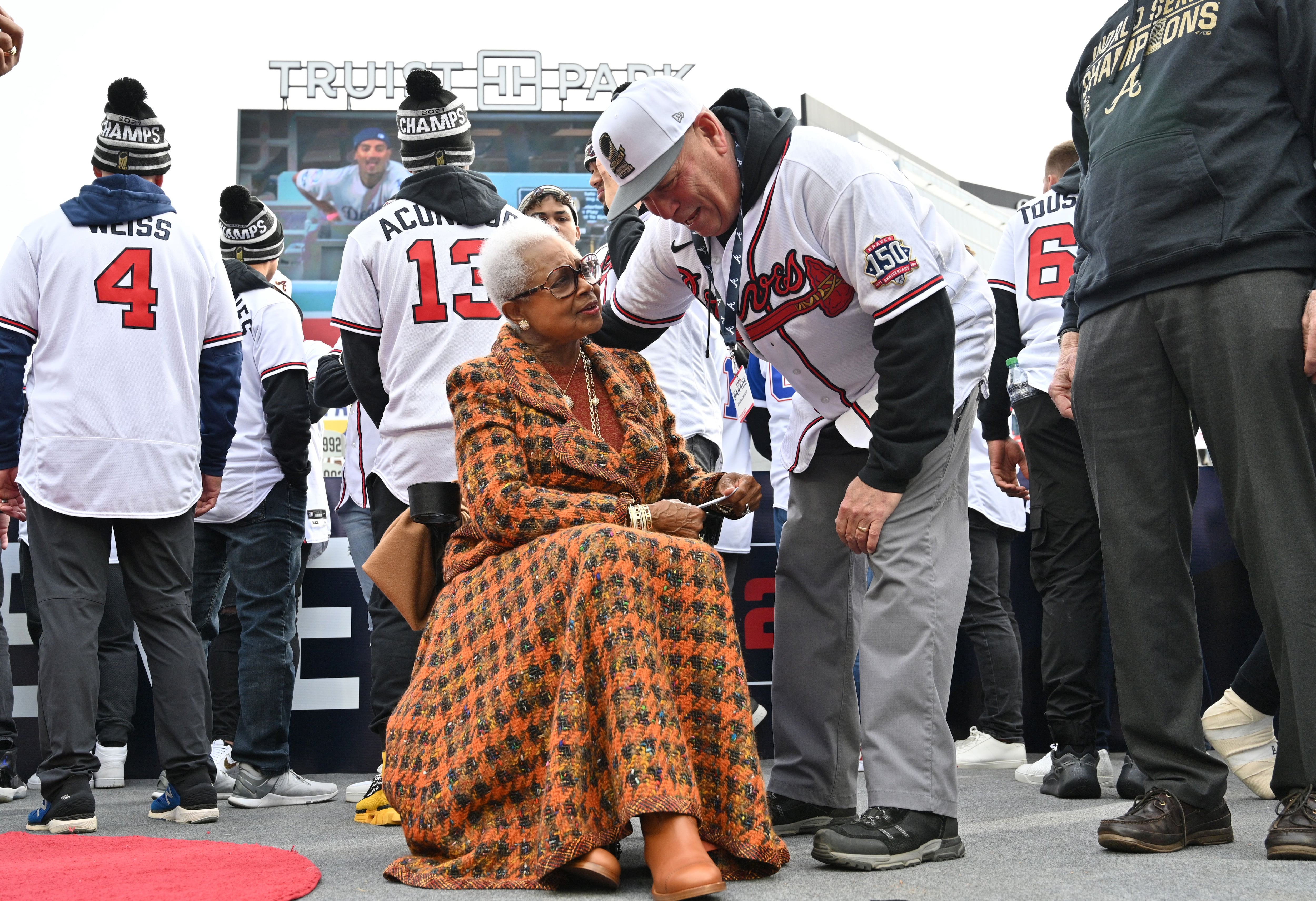 ATLANTA, GA - NOVEMBER 05: Coach Brian Snitker #43 of the Atlanta Braves  and family during the Celebration at Truist Park on November 5, 2021 in  Atlanta, Georgia. (Photo by David J.