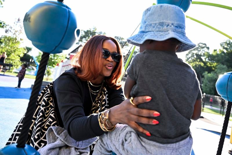 Ferguson activist Brittany Packnett-Cunningham plays with her son MVP at a playground, Saturday, Sep. 7, 2024, in Mount Rainier, Md. (AP Photo/Terrance Williams)