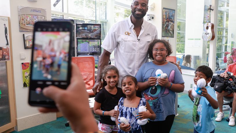 NFL legend visits with Johnson family
