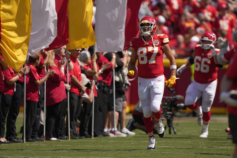 Kansas City Chiefs tight end Travis Kelce (87) runs onto the field before an NFL preseason game against the Detroit Lions Saturday, Aug. 17, 2024, in Kansas City, Mo. (AP Photo/Charlie Riedel)