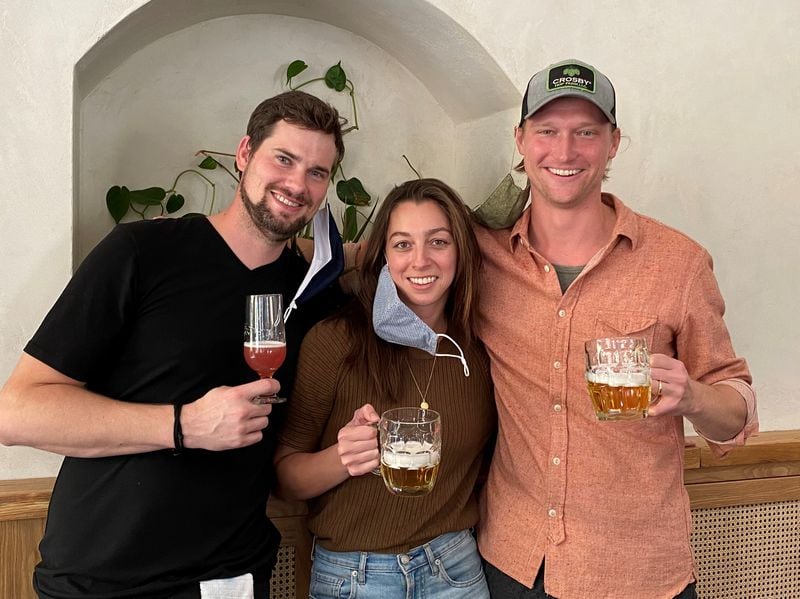 Elsewhere Brewing’s Josh Watterson (left) and Sara and Sam Kazmer recently opened a second location in West Midtown called The Greenhouse.
(Bob Townsend for the Atlanta Journal Constitution)