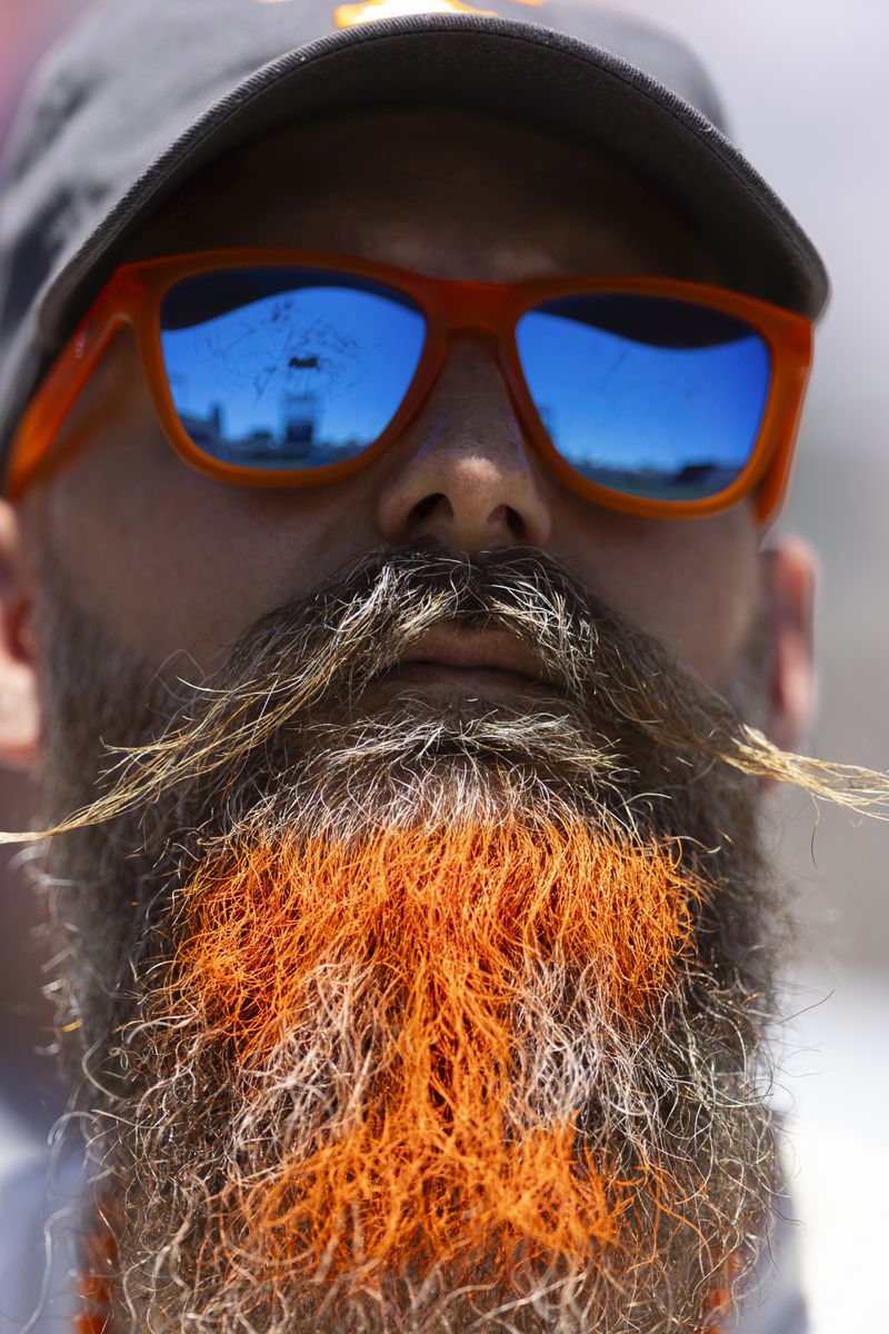 A fan looks on as Tennessee plays against Texas A&M in Game 2 of the NCAA College World Series baseball finals in Omaha, Neb., Sunday, June 23, 2024. (AP Photo/Rebecca S. Gratz)