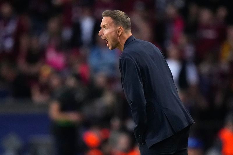 Salzburg's ead coach Pepijn Lijnders shuts from the touchline during the Champions League opening phase soccer match between Sparta Prague and Salzburg in Prague, Czech Republic, Wednesday, Sept. 18, 2024. (AP Photo/Petr David Josek)