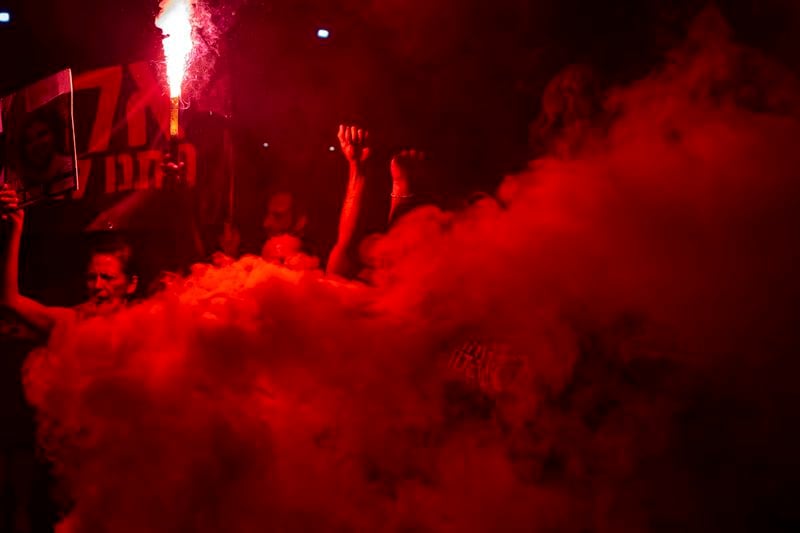 Relatives of hostages held by Hamas in the Gaza Strip and their supporters protest in Tel Aviv, Israel, Thursday, Aug. 15, 2024. (AP Photo/Ohad Zwigenberg)