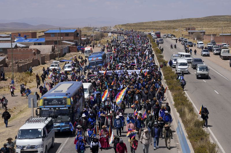 Supporters of former President Evo Morales march to the capital to protest against the government of current President Luis Arce in an escalation of a political dispute between the two politicians, in Vila Vila, Bolivia Tuesday, Sept. 17, 2024. (AP Photo/Juan Karita)