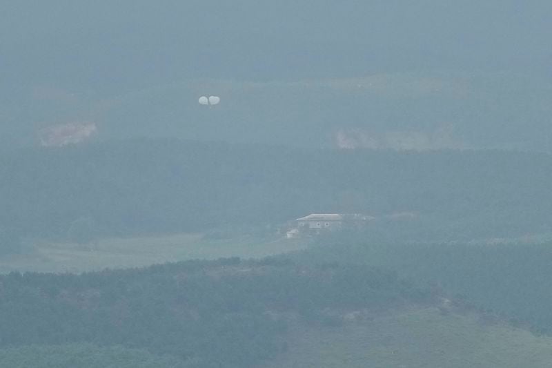 Balloons are seen from the Unification Observation Post in Paju, South Korea, near the border with North Korea, Thursday, Sept. 5, 2024. (AP Photo/Lee Jin-man)