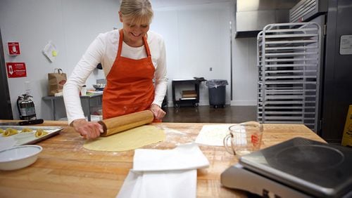 Baker Karen Hansen, owner of Copenhagen Pastry, rolls out the dough to make Napoleon hat cookies at her bakery on Dec. 7, 2015 in Pasadena, Calif. (Genaro Molina/Los Angeles Times/TNS)