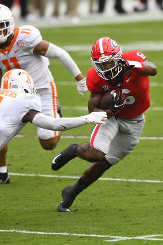 Georgia running back Kenny McIntosh (6) rushes against Tennessee during the first half of a football game Saturday, Oct. 10, 2020, at Sanford Stadium in Athens. JOHN AMIS FOR THE ATLANTA JOURNAL- CONSTITUTION