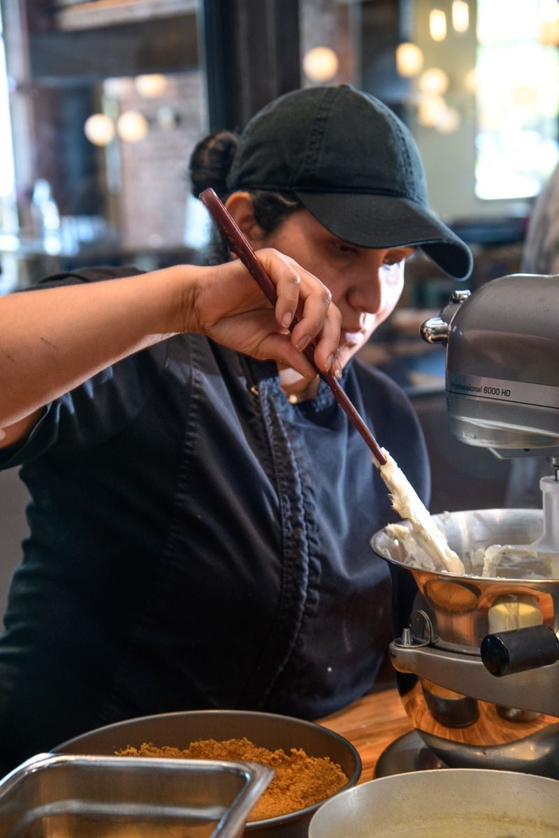 Chef Alva Najera mixes the ingredients for a no-bake MoonPie cheesecake. (Photo by Mark Gilliland)