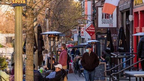 Decatur Square is busy on the first official day of Spring, Saturday, March 20, 2021 with families and outdoor diners enjoying the weather, live music and ice cream.  (Jenni Girtman for The Atlanta Journal-Constitution)