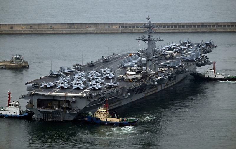 The Theodore Roosevelt (CVN 71), a nuclear-powered aircraft carrier is anchored in Busan, South Korea, Saturday, June 22, 2024. (Song Kyung-Seok/Pool Photo via AP)