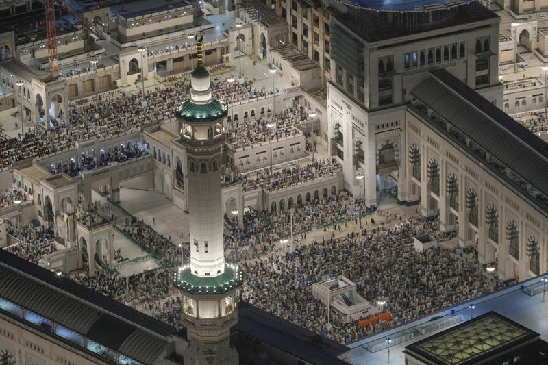 Muslim pilgrims offer prayers at the Grand Mosque, during the annual Hajj pilgrimage in Mecca, Saudi Arabia, Tuesday, June 11, 2024. (AP Photo/Rafiq Maqbool)