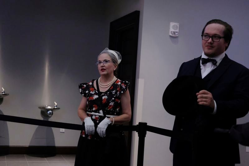 Visitors stand in Ryman Auditorium after attending a concert by the band Postmodern Jukebox in Nashville, Tenn., on July 30, 2024. (AP Photo/Luis Andres Henao)