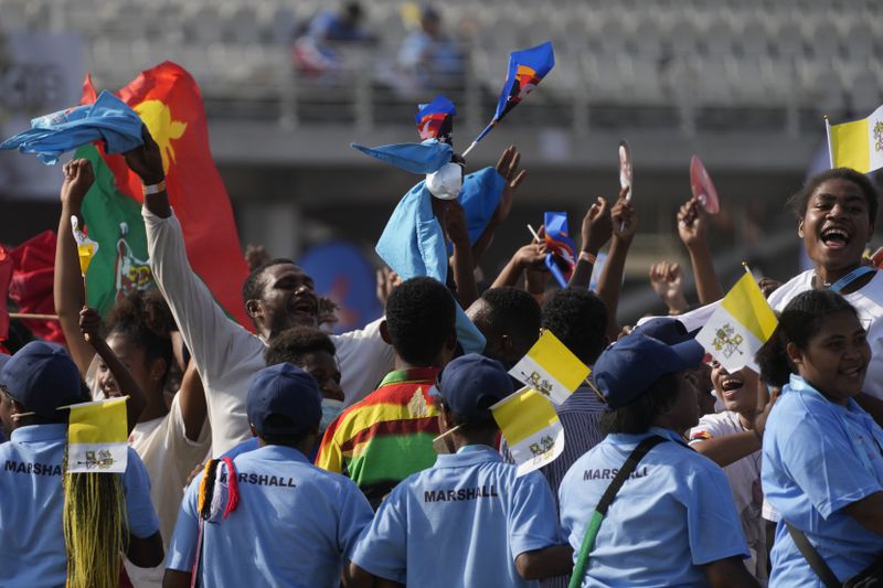 Faithful attend a meeting between Pope Francis and young people at the Sir John Guise stadium in Port Moresby, Monday, Sept. 9, 2024. (AP Photo/Gregorio Borgia)