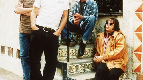 R.E.M. is pictured in this May 1994 file photo from left to right: Mike Mills, Michael Stipe, Bill Berry and Peter Buck.