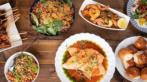 A spread of food served at one of the family dining experiences at the 2023 Family Reunion, hosted by Chef Kwame Onwuachi at Salamander Middleburg in Virginia.