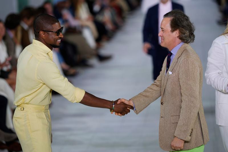 Usher, left, and David Lauren attend the Ralph Lauren Spring/Summer 2025 fashion show as part of New York Fashion Week on Thursday, Sept. 5, 2024, at Khalily Stables in Bridgehampton, N.Y. (Photo by Charles Sykes/Invision/AP)