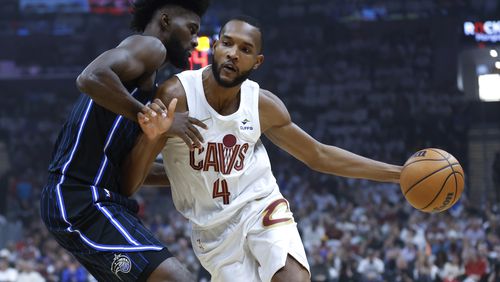 FILE - Cleveland Cavaliers forward Evan Mobley (4) drives against Orlando Magic forward Jonathan Isaac during the first half of Game 2 of an NBA basketball first-round playoff series, April 22, 2024, in Cleveland. Mobley has agreed to a five-year, $224 million contract extension with Cleveland, a person familiar with the negotiations told The Associated Press on Saturday, July 20. (AP Photo/Ron Schwane, File)