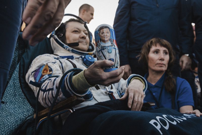 In this photo released by Roscosmos space corporation, Roscosmos cosmonaut Oleg Kononenko holds a Russian traditional Matryoshka wooden doll depicting him shortly after the landing of the Russian Soyuz MS-25 space capsule carrying NASA astronaut Tracy Dyson, Roscosmos cosmonauts Oleg Kononenko and Nikolai Chub, south-east of the Kazakh town of Zhezkazgan, Kazakhstan, Monday, Sept. 23, 2024. (Ivan Timoshenko, Roscosmos space corporation via AP)