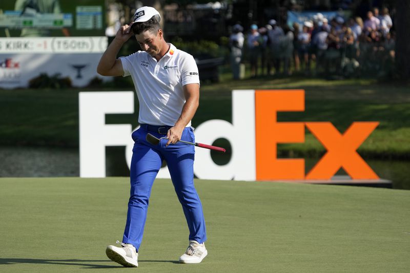 Viktor Hovland, of Norway, walks off the 18th green after the final round of the St. Jude Championship golf tournament Sunday, Aug. 18, 2024, in Memphis, Tenn. (AP Photo/Mark Humphrey)