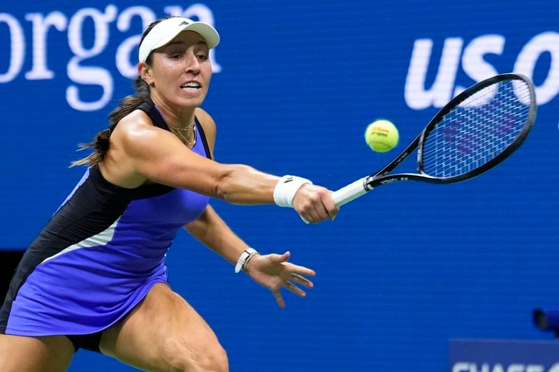 Jessica Pegula, of the United States, stretches for a return against Iga Świątek, of Poland, during the quarterfinals of the U.S. Open tennis championships, Wednesday, Sept. 4, 2024, in New York. (AP Photo/Eduardo Munoz Alvarez)