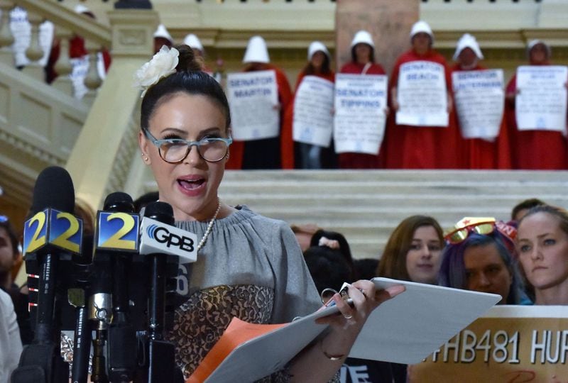 Actress Alyssa Milano reads a letter to Gov. Brian Kemp, urging him to oppose the “heartbeat bill” during the last day of the 2019 Georgia General Assembly at the state Capitol. (Hyosub Shin/ hshin@ajc.com)