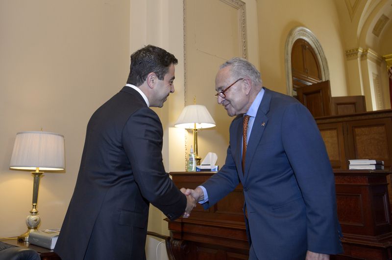 Senator-designee George Helmy, D-N.J., left, meets with Senate Majority Leader Chuck Schumer, D-N.Y., prior to taking the oath of office in the Old Senate Chamber at the Capitol in Washington, Monday, Sept. 9, 2024. (AP Photo/Rod Lamkey, Jr.)