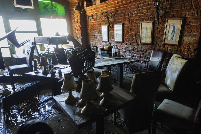 A caffe is seen damaged after the high flood waves passed through the town, in Nysa, southwestern Poland, on Wednesday, Sept. 18, 2024. (AP Photo/Krzysztof Zatycki)