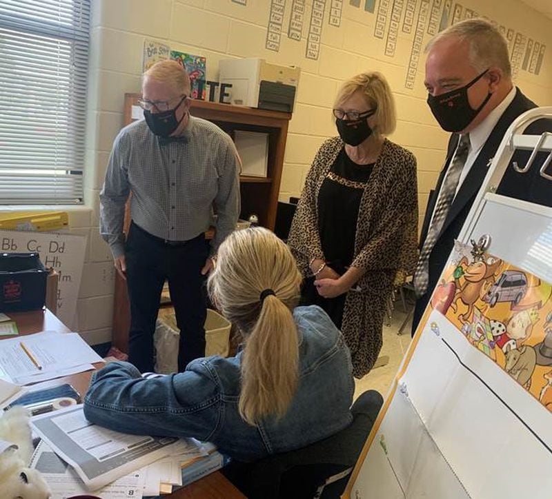 Superintendent Woods; his wife, Lisha Woods; and Cherokee County Schools Superintendent Brian Hightower visit a classroom at Hasty Elementary School.