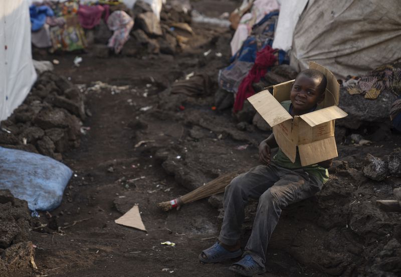 A child plays in the Bulengo refugee camp in Goma, Congo, after the World Health Organization had declared Thursday, Aug, 15, 2024, the increasing spread of mpox in Africa a global health emergency, warning the virus might ultimately spill across international borders. (AP Photo/Moses Sawasawa)