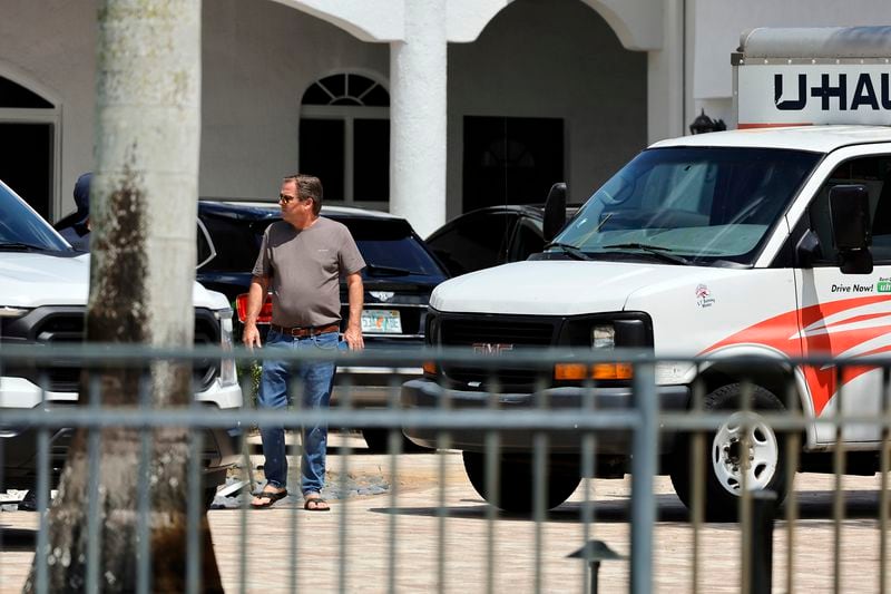Attorney Dennis Card walks out of Sean Kingston's home in the suburb of Southwest Ranches, Fla., Thursday, May 23, 2024. A SWAT team raided rapper Kingston's rented mansion on Thursday, and arrested his mother on fraud and theft charges that an attorney says stems partly from the installation of a massive TV at the home. Broward County detectives arrested Janice Turner, 61, at the home. (Amy Beth Bennett/South Florida Sun-Sentinel via AP)