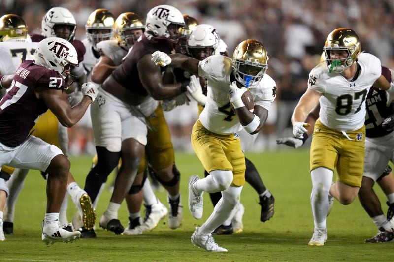 Notre Dame running back Jeremiyah Love (4) breaks free for a touchdown run late in the fourth quarter against Texas A&M during an NCAA college football game Saturday, Aug. 31, 2024, in College Station, Texas. (AP Photo/Sam Craft)