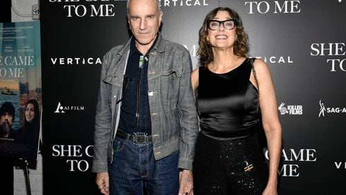 FILE - Writer-director Rebecca Miller, right, and husband Daniel Day-Lewis attend a special screening of "She Came to Me" at Metrograph, Oct. 3, 2023, in New York. (Evan Agostini/Invision/AP, File)