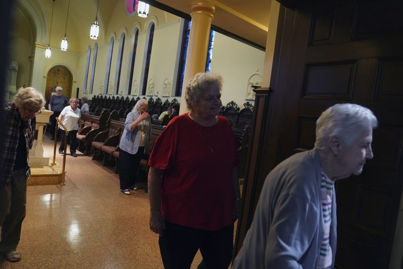 Sisters leave the chapel after morning prayer at the Mount St. Scholastica Benedictine monastery in Atchison, Kan., Wednesday, July 17, 2024. (AP Photo/Jessie Wardarski)